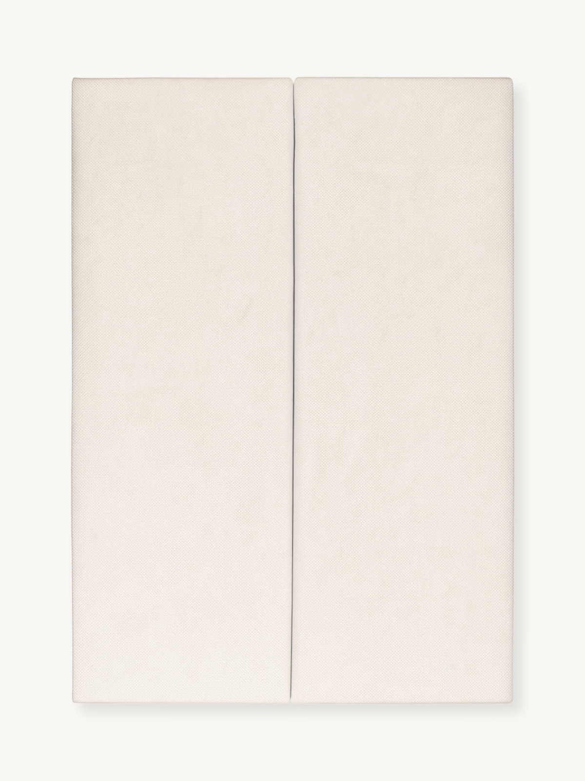 Cream white toddler mattress shown flat from above, two-panel split-top design with subtle textured fabric surface