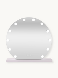 Round white Hollywood vanity mirror with 14 illuminated bulbs around the edge, touch controls visible, on a flat base, fro…