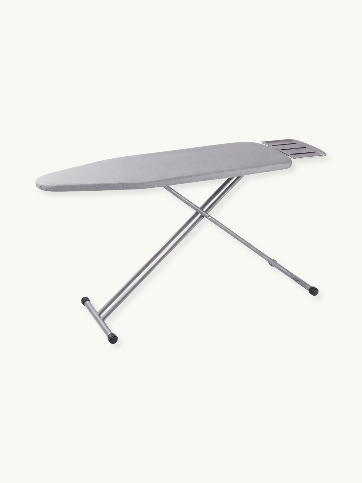 Light grey ironing board with silver steel X-frame legs, slotted iron rest at narrow end, rubber feet, angled product view