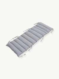 Grey padded cushion for climbing arch with tie strings at corners, angled top view on white background