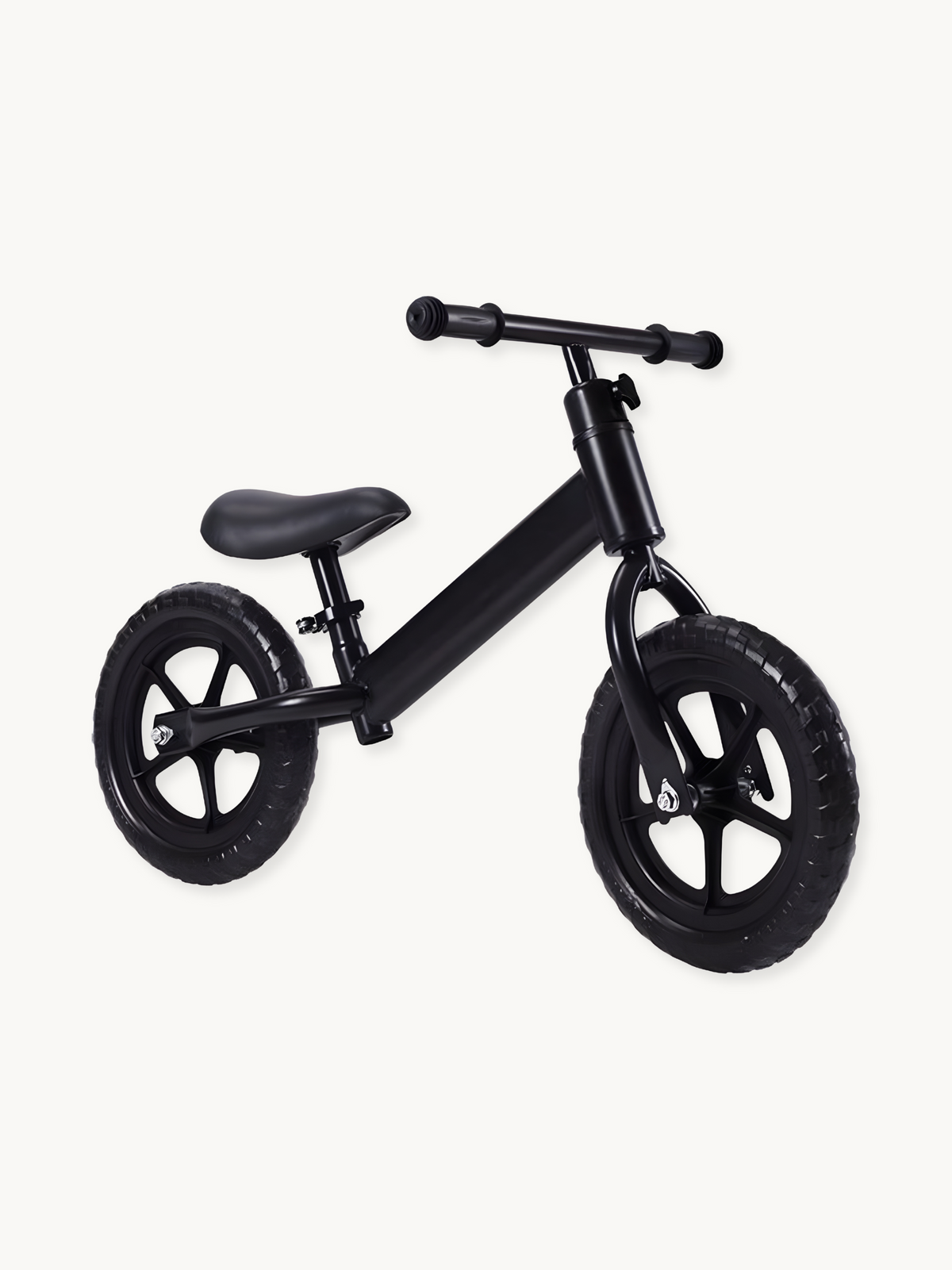 Matte black kids balance bike with five-spoke wheels, padded saddle, and T-bar handlebars, shown at a slight angle on whit…