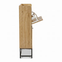 Side profile of oak-finish shoe cabinet with one flip door open, revealing white metal hinge mechanism, black metal legs v…