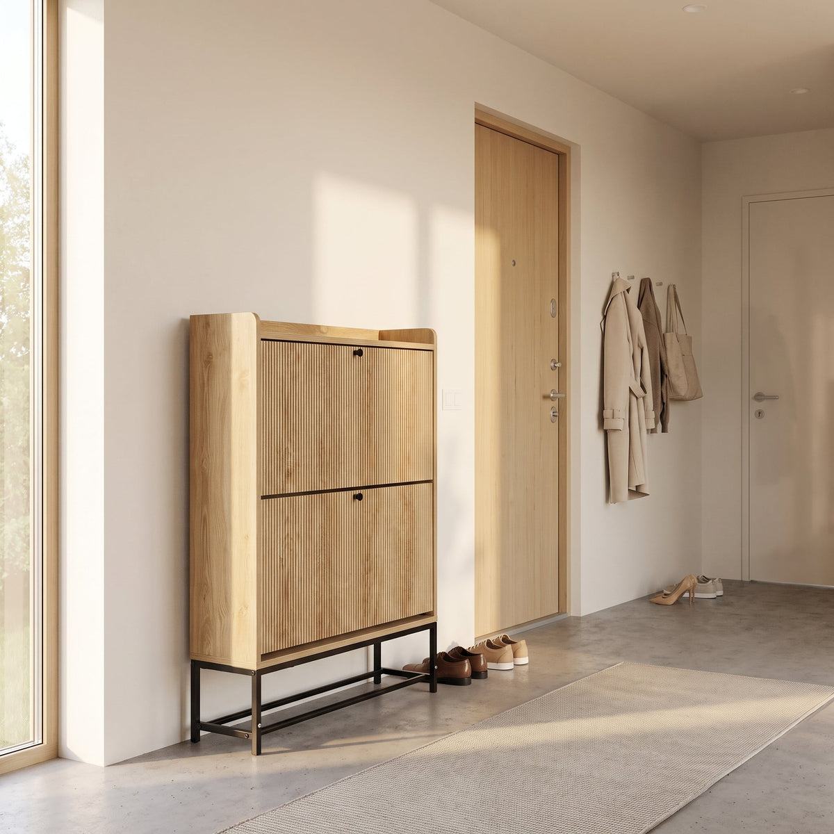 Oak-finish Japandi shoe cabinet in a hallway, front-facing, with ribbed doors and black metal legs, shoes stored underneath