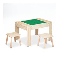 Natural wood children's activity table with recessed green building plate surface and two small matching stools, angled vi…