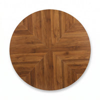 Flat overhead close-up of round walnut tabletop showing mirrored herringbone wood grain segments radiating from centre point