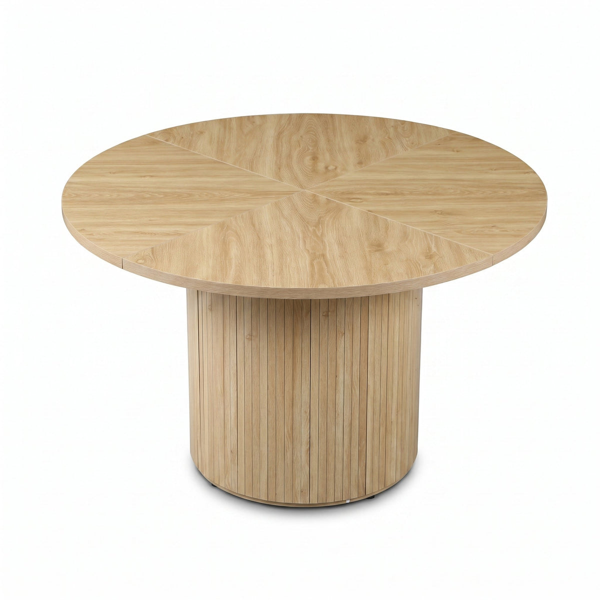Angled top-down view of round oak dining table showing radiating wood-grain segments on tabletop and vertical-slatted cyli…