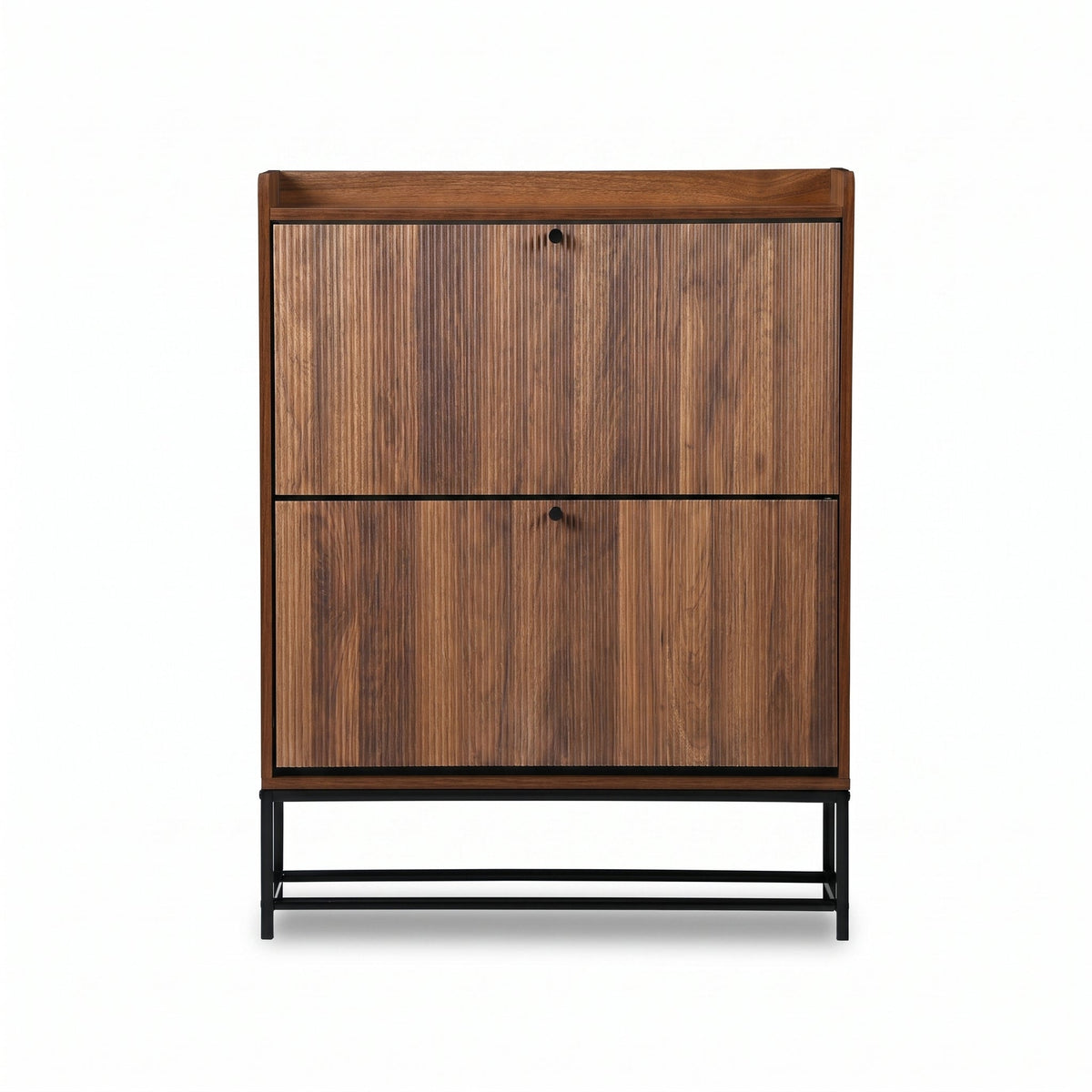 Walnut shoe cabinet front view, two closed flip-down doors with black knobs, raised on slim black metal base, white backgr…