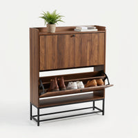 Walnut shoe cabinet with lower flip-down door open, showing three pairs of shoes stored inside, ribbed upper door closed,…