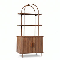 Walnut wood bookcase with arched metal frame, two ribbed sliding doors, and two open display shelves, front view on white…