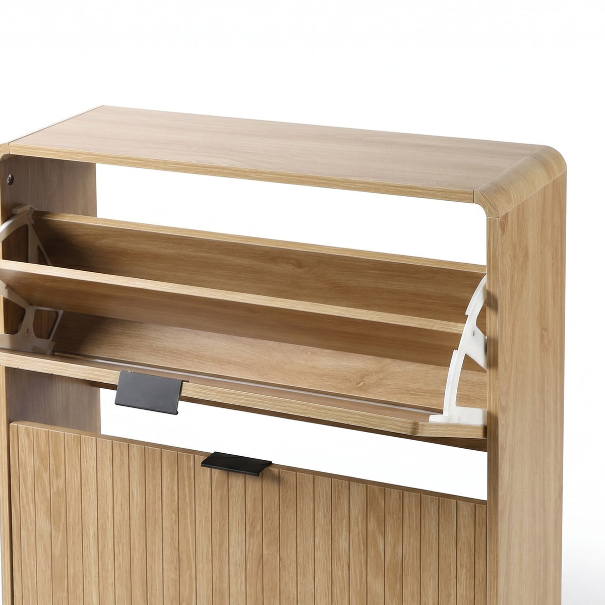 Close-up of upper flip-down compartment open on oak shoe cabinet, revealing internal shelf and white metal hinge mechanism