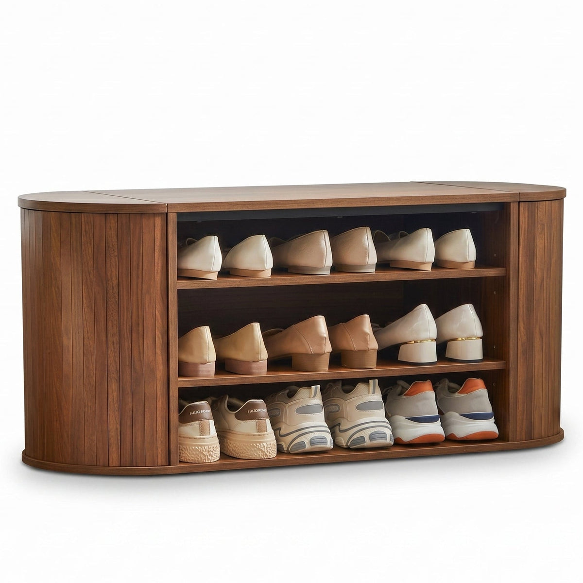 Walnut oval shoe bench, three open shelves filled with flats and trainers, curved ribbed side panels, flat product shot on…