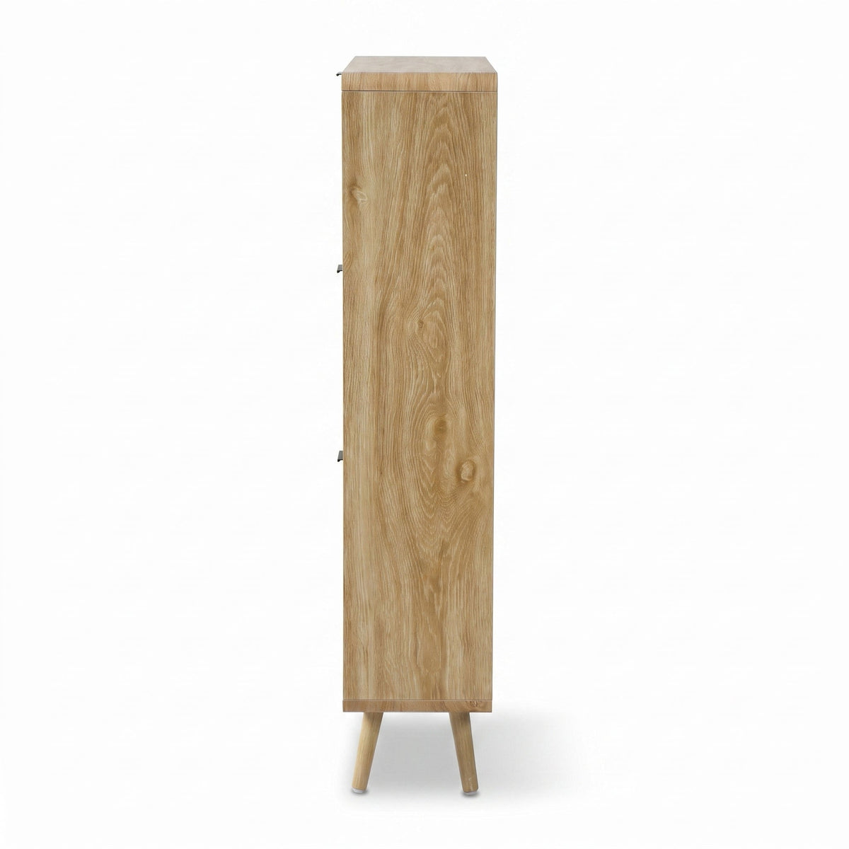 Side profile of tall oak-finish shoe cabinet showing wood grain texture, slim depth, and two angled splayed legs on white…