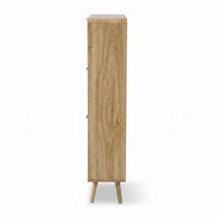 Side profile of tall oak-finish shoe cabinet showing wood grain texture, slim depth, and two angled splayed legs on white…