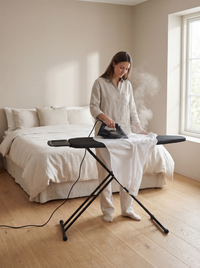 Ironing board with steam unit holder