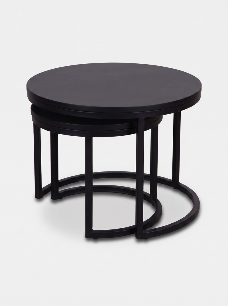 Black round nesting side table set nested together, angled view showing staggered heights and curved steel hoop bases bene…