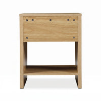 Back view of light oak bedside table showing visible screw fixings, open lower shelf, and sled-style base on white background