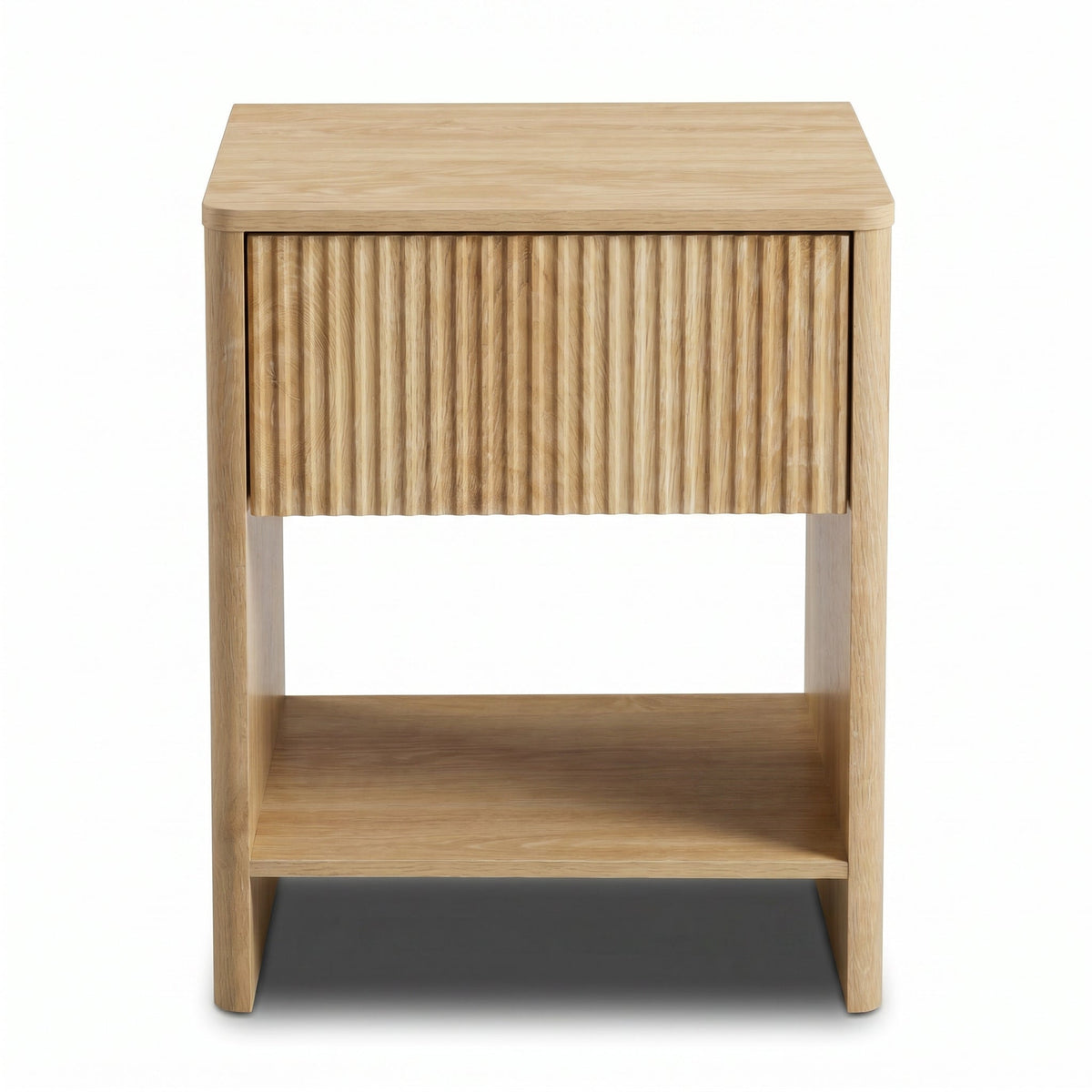 Light oak bedside table front view, vertically ribbed drawer front, open lower shelf, tapered legs on white background