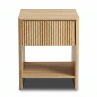 Light oak bedside table front view, vertically ribbed drawer front, open lower shelf, tapered legs on white background