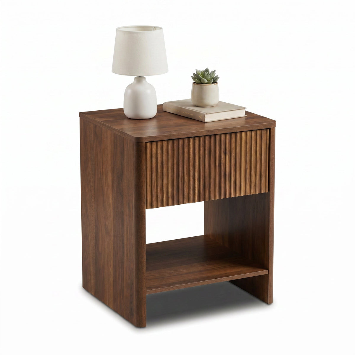 Walnut nightstand styled with white table lamp, succulent and stacked books on top, ribbed drawer and open shelf shown at…