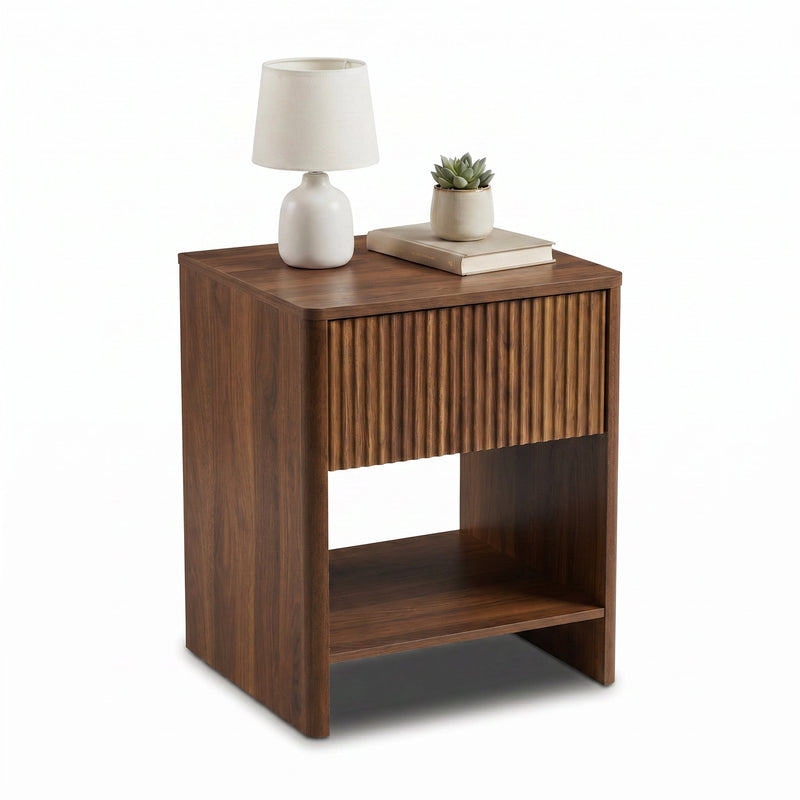 Walnut nightstand styled with white table lamp, succulent and stacked books on top, ribbed drawer and open shelf shown at…