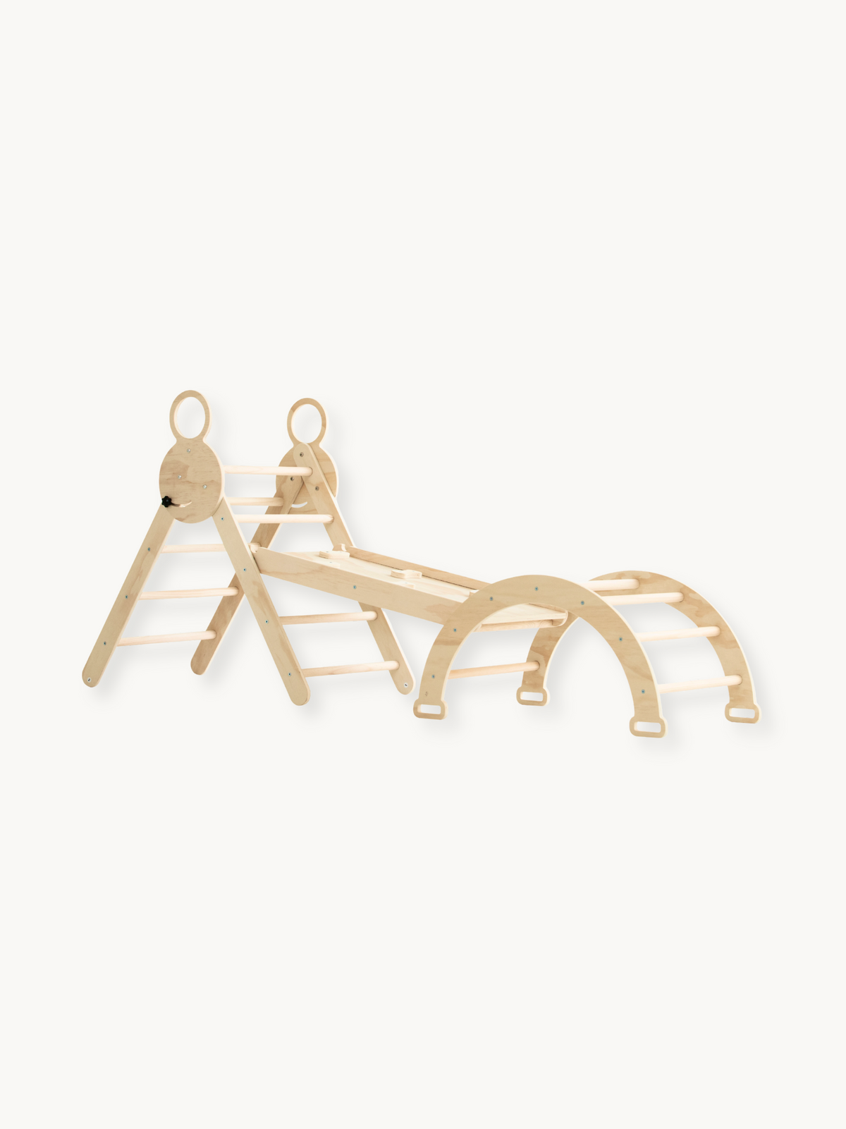 Natural birch wood climbing set laid flat showing triangle ladder, connecting slide ramp, and arch rocker arranged in a li…