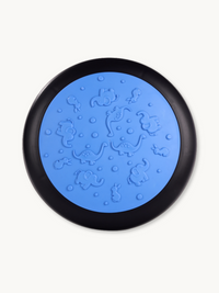 Blue balance disc with black rim, top-down view showing embossed animal pattern including elephants, dinosaurs, and rabbits