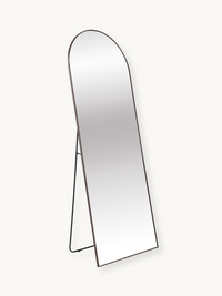 Angled side view of the Eden arched floor mirror, showing thin brown aluminium frame and slim A-frame easel stand