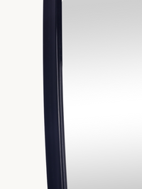 Close-up of slim black PVC left-side frame edge on Leandro organic wall mirror, showing profile depth and finish detail