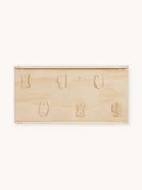 Natural birch wood climbing board panel showing six varied wooden holds screwed onto flat plywood surface, front-on view