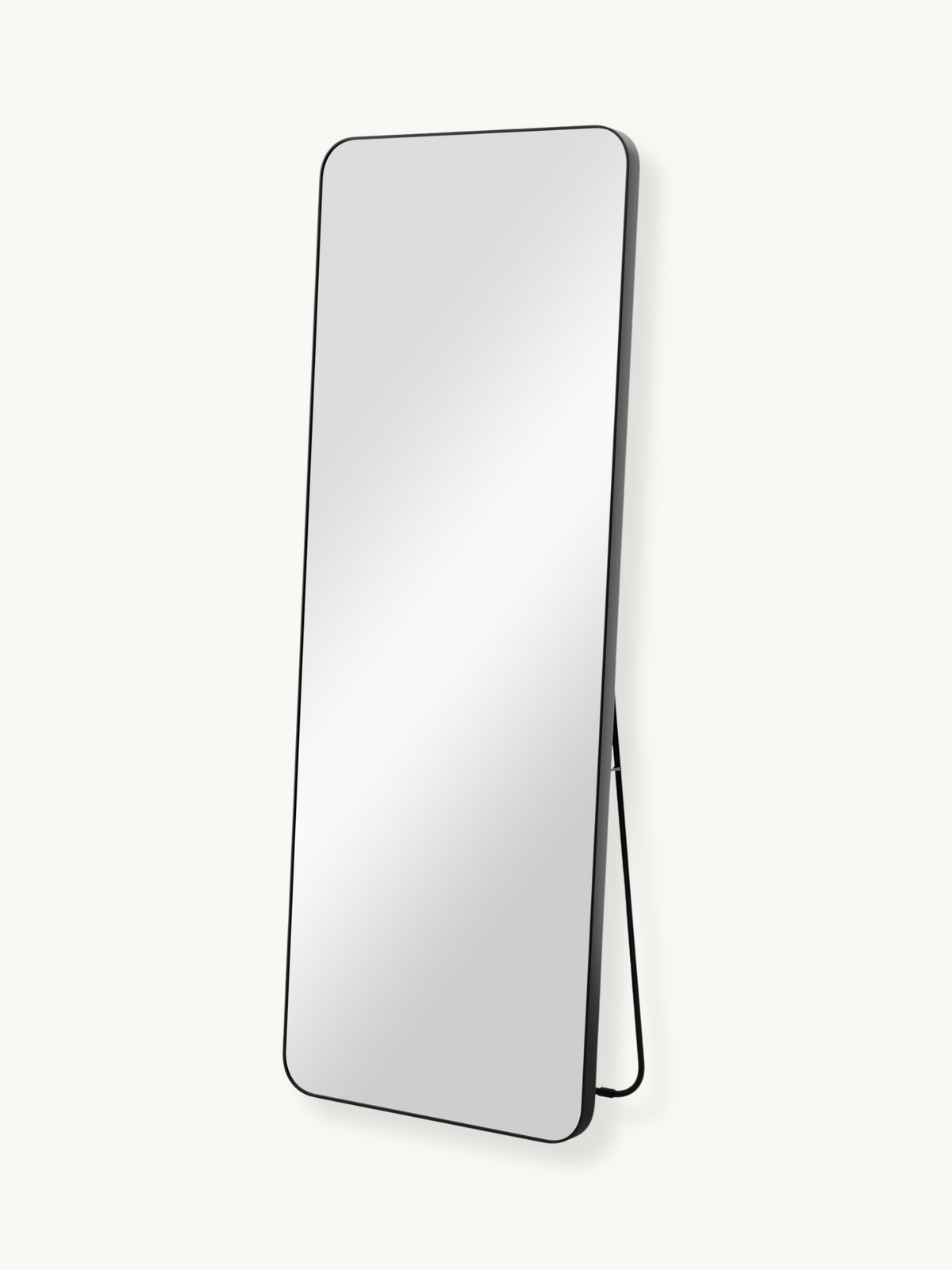 Black full-length standing mirror with thin aluminium frame and slim metal kickstand, angled three-quarter view on white b…