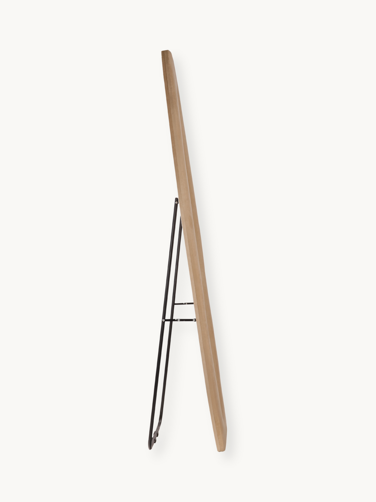 Side profile of Seraphina floor mirror showing natural taupe suede velvet-wrapped frame edge and black metal folding stand