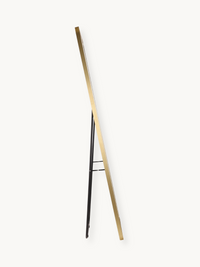 Side profile view of gold aluminium full-length mirror with black metal kickstand extended, white background