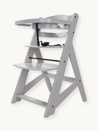 Grey wooden highchair angled front-left view, tray attached, black harness visible, adjustable footrest and seat, no cushi…