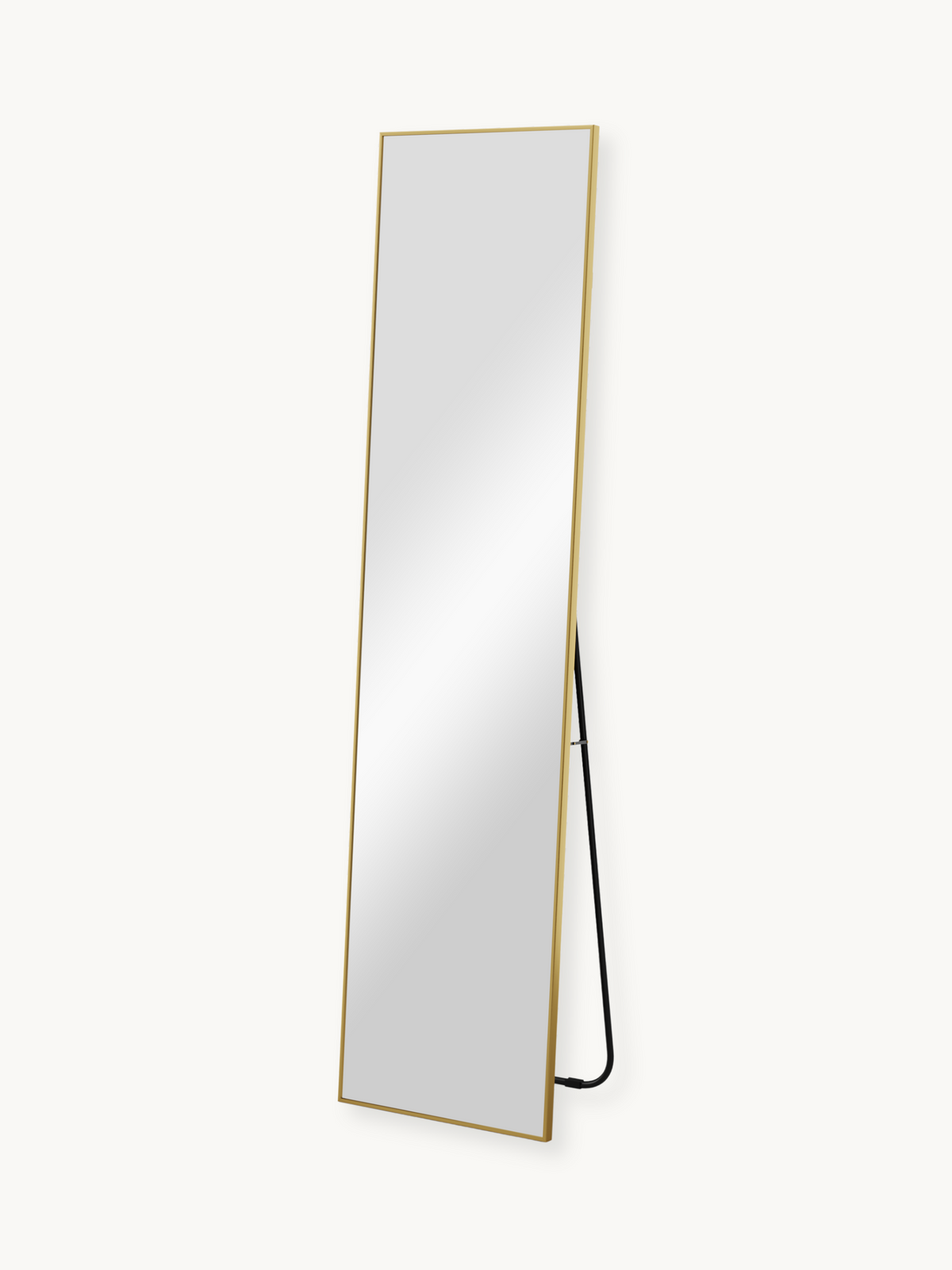 Full-length Angelo mirror with slim gold frame leaning at an angle, black metal floor stand visible from the side, white b…