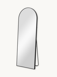Black arched floor mirror on easel stand, angled three-quarter view showing slim aluminium frame and A-frame support