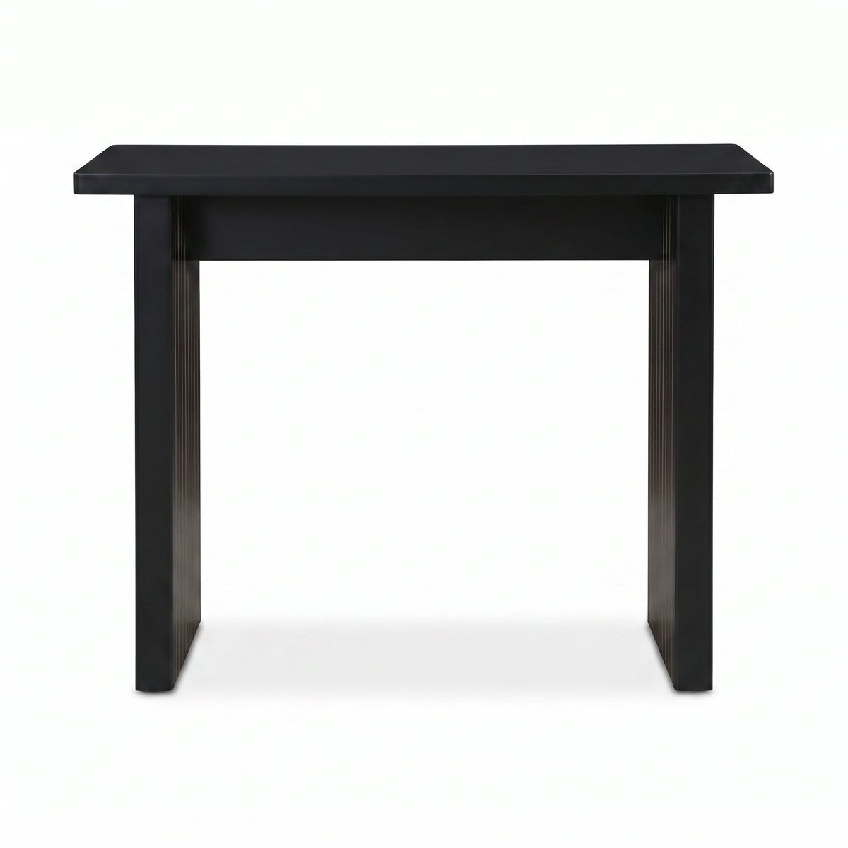 Black console table front view, flat rectangular top, vertical ribbed panel legs with warm wood grain visible, white backg…