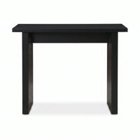 Black console table front view, flat rectangular top, vertical ribbed panel legs with warm wood grain visible, white backg…