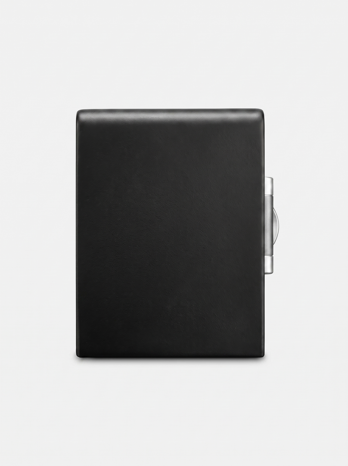 Black leather-wrapped fireproof safe rear exterior, smooth surface with silver hinge mechanism visible on right edge, whit…