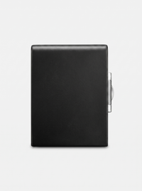 Black leather-wrapped fireproof safe rear exterior, smooth surface with silver hinge mechanism visible on right edge, whit…