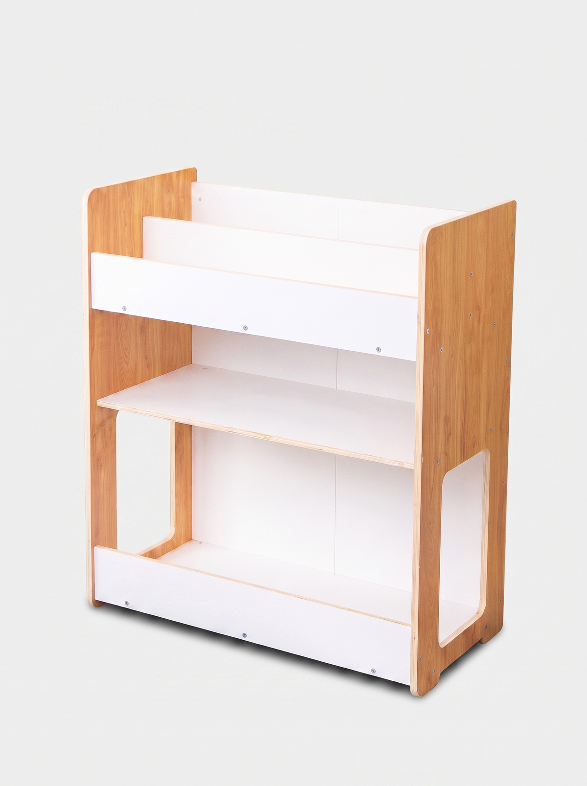 Three-tier children's bookcase with natural wood sides and white shelves, angled front view, no bins shown, light grey bac…
