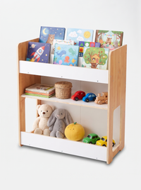 Natural wood and white kids bookcase filled with colourful children's board books on top slots, wooden toy cars, plush ted…