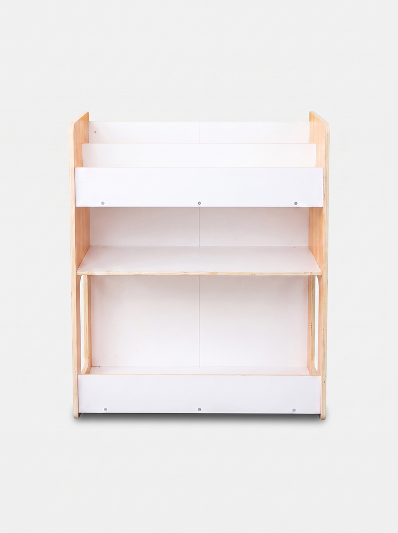 Front-on view of empty three-tier kids bookcase, natural pine sides, white panel shelves, bottom storage rail, no bins ins…
