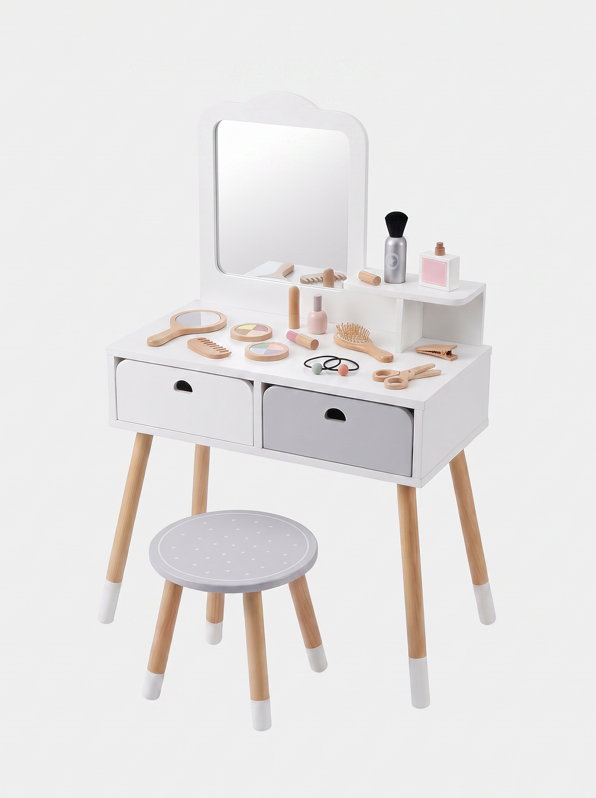 White wooden children's vanity table with mirror, two drawers, matching round stool, and wooden toy makeup accessories lai…