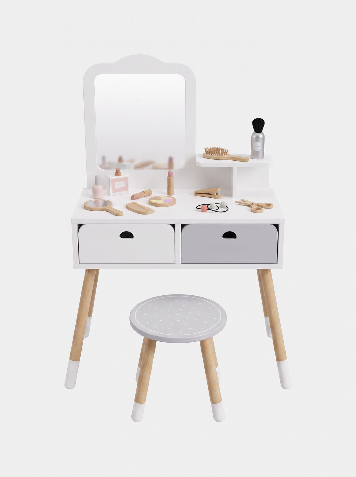 White wooden kids' vanity set front view, two-tone drawers, arched mirror, round dotted stool, and wooden toy makeup acces…
