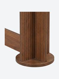 Japandi console table with ribbed column legs and oval tabletop