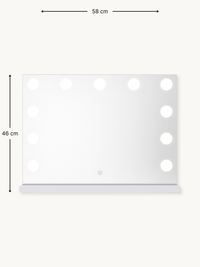 White Hollywood vanity mirror with dimension annotations showing 58 cm width and 46 cm height, 12 LED bulbs visible along…