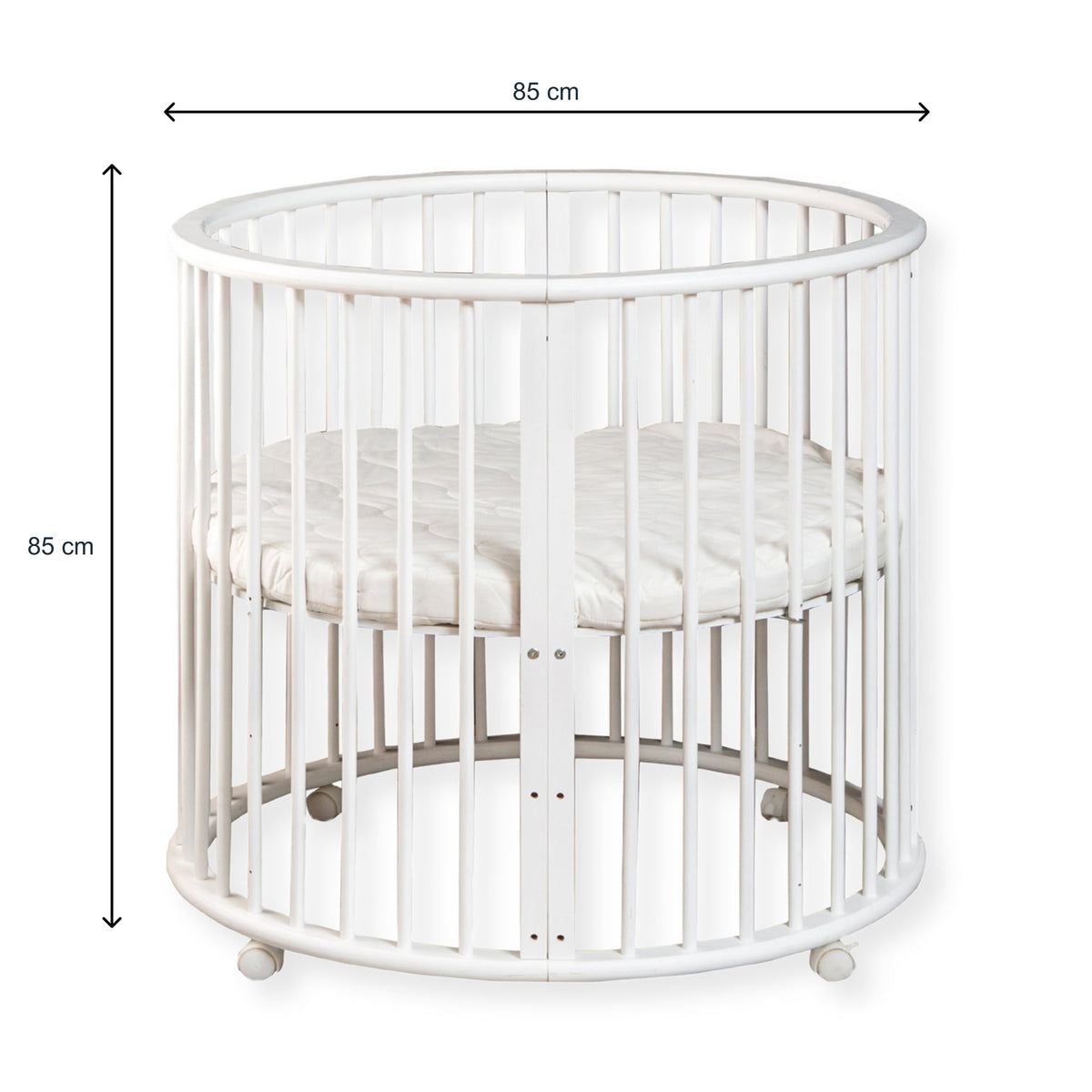 White round wooden baby playpen with dimension arrows showing 85 cm width and 85 cm height, cream mattress inside, white b…